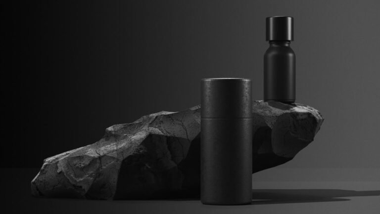 bottle-of-essential-massage-oil-on-stone-beauty-treatment-minimal-black-design-packaging-mock-up